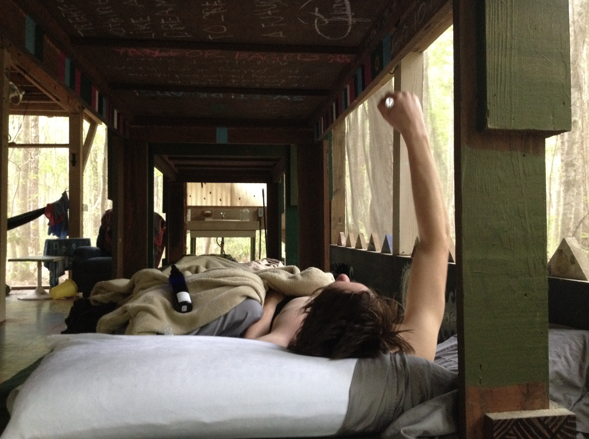 Person resting in the long open dormitory